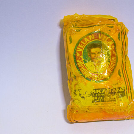 A vibuthi packet with yellow colour cover