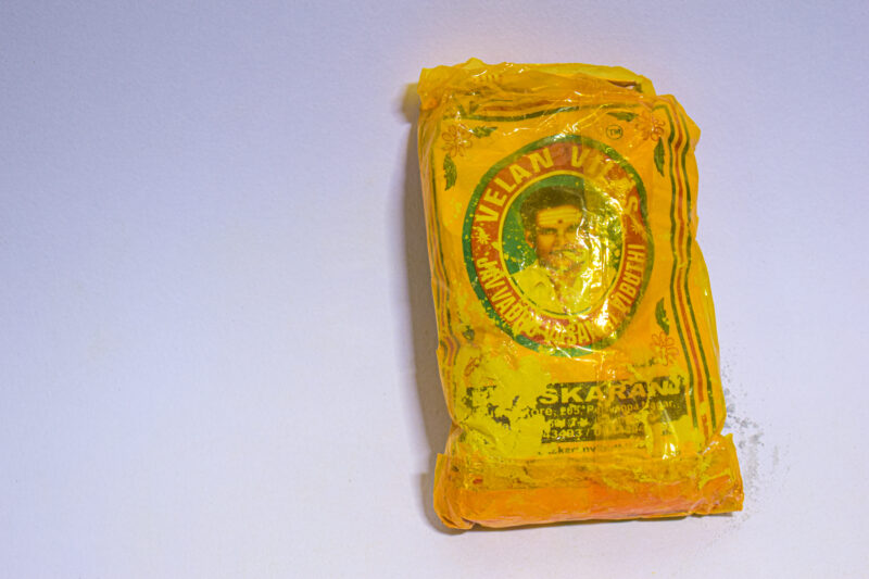 A vibuthi packet with yellow colour cover